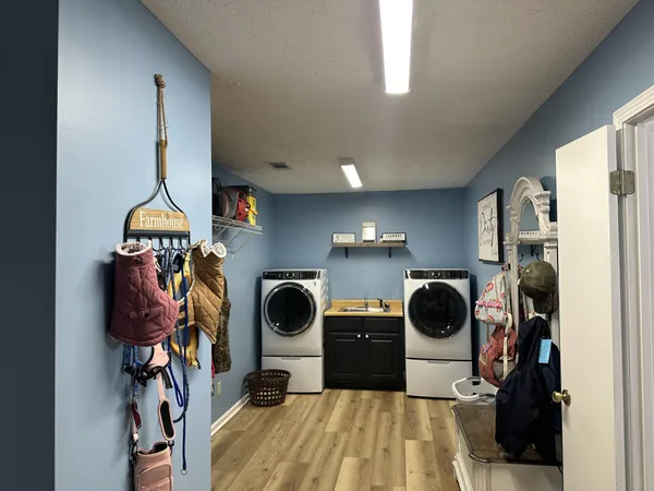 a view of a kitchen filled with furniture and a utility room