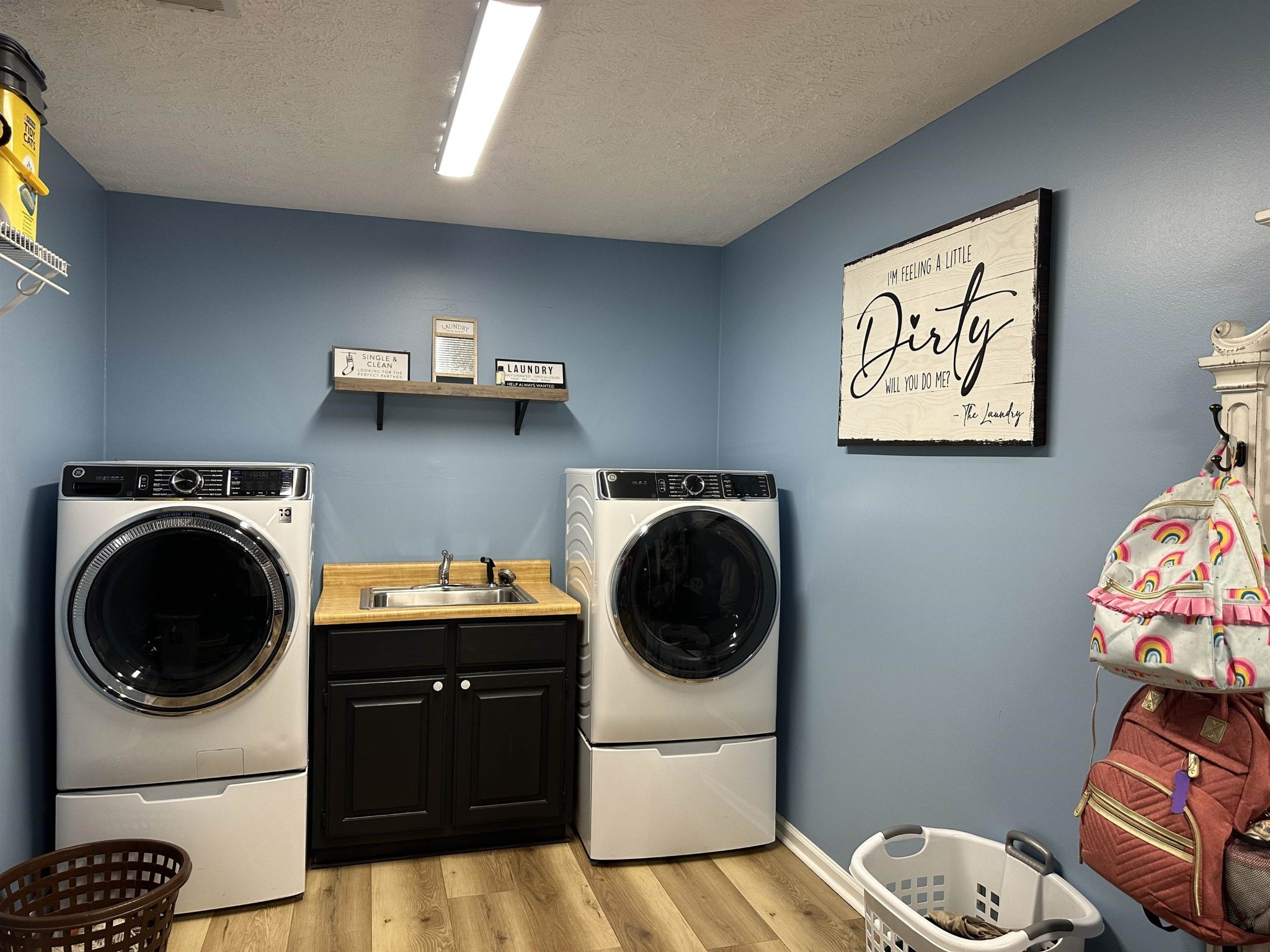 58 Bowman Loop Beech Bluff, TN 38313 - Photo 32 of 40 a utility room with sink dryer and washer