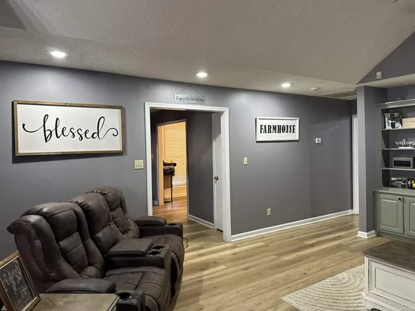 a view of a livingroom with workspace and a couch