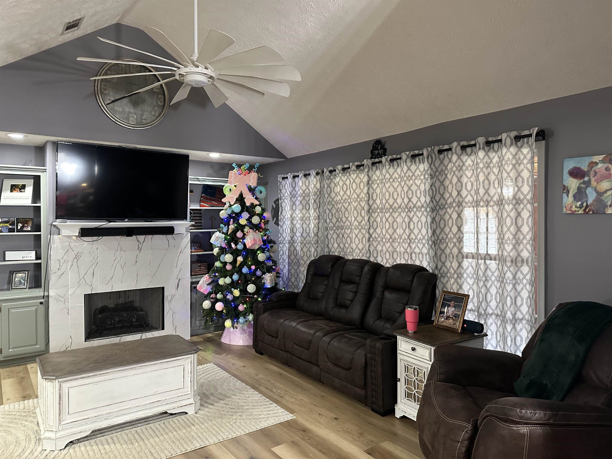 58 Bowman Loop Beech Bluff, TN 38313 - Photo 10 of 40 a living room with furniture a flat screen tv and a fireplace