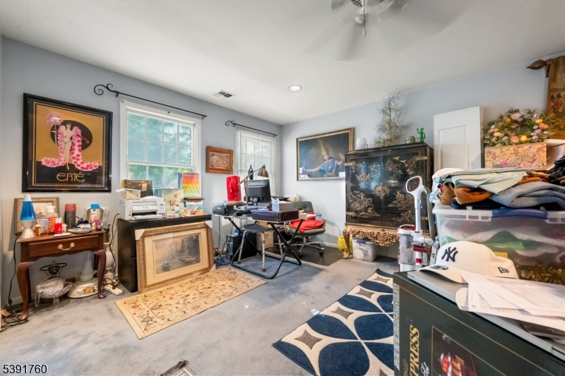 95 Quartz Lane Paterson, NJ 07501 - Photo 12 of 13 a living room with furniture and a flat screen tv