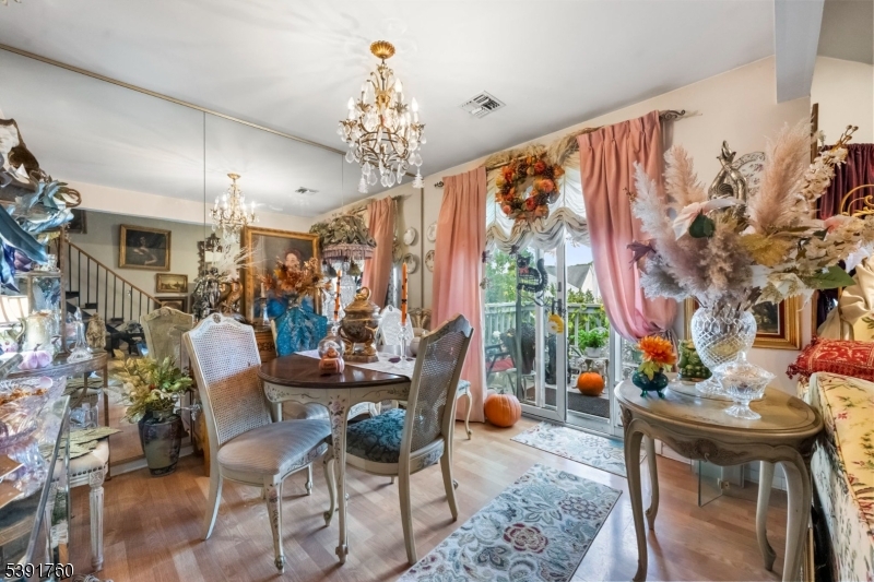 95 Quartz Lane Paterson, NJ 07501 - Photo 4 of 13 a view of a dining room with furniture and chandelier