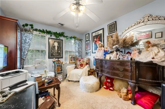 a living room with lots of furniture and a flat screen tv