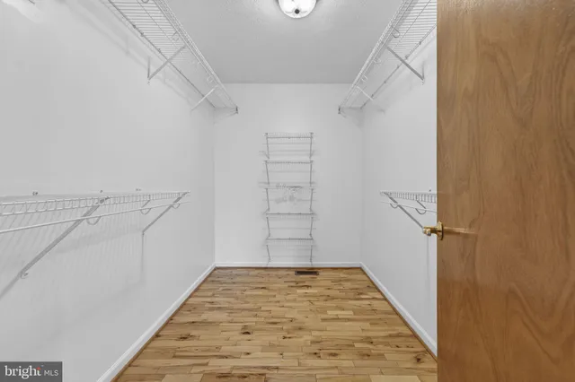 view of a bathroom with a sink and a mirror