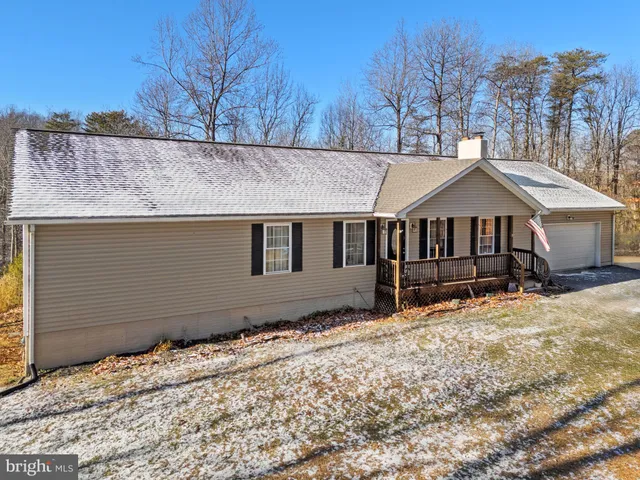 a house with trees in the background
