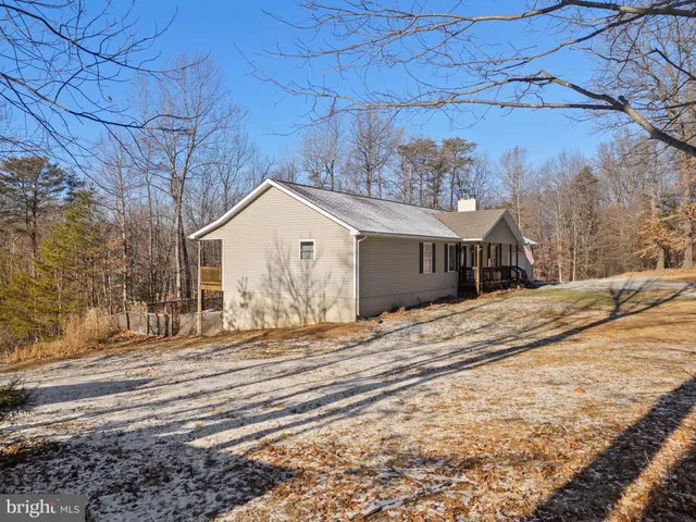 a view of house with snow on the road