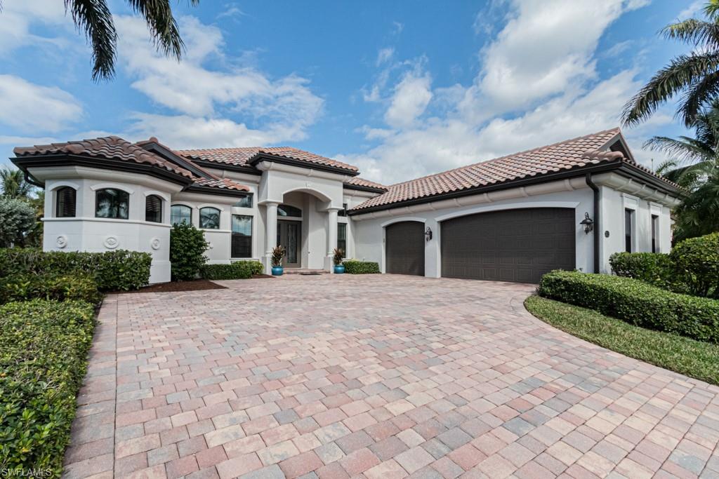 3273 Runaway Lane Naples, FL 34114 - Photo 2 of 45 a front view of a house with a garden