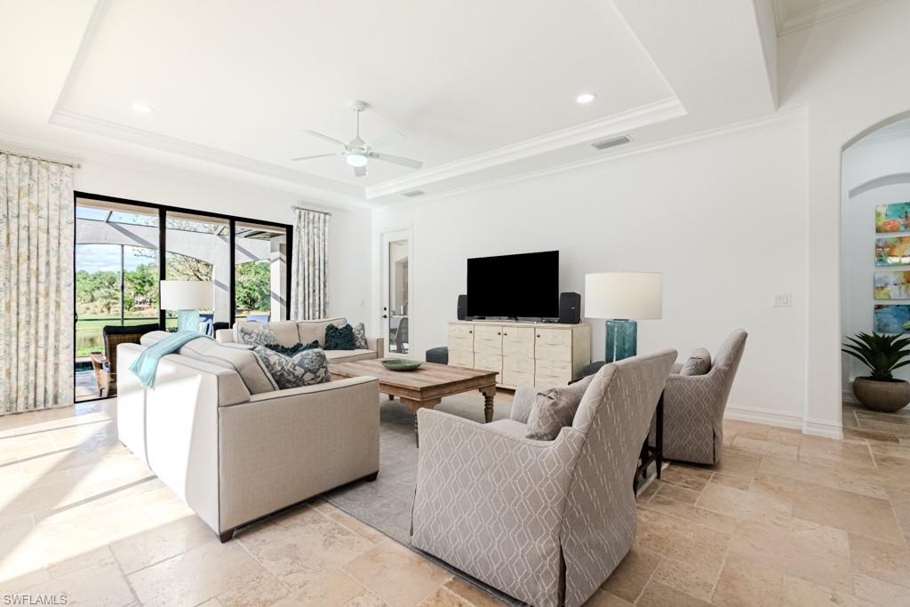 3273 Runaway Lane Naples, FL 34114 - Photo 21 of 45 a living room with furniture and a flat screen tv