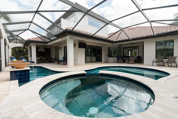 a view of a swimming pool with a sitting area