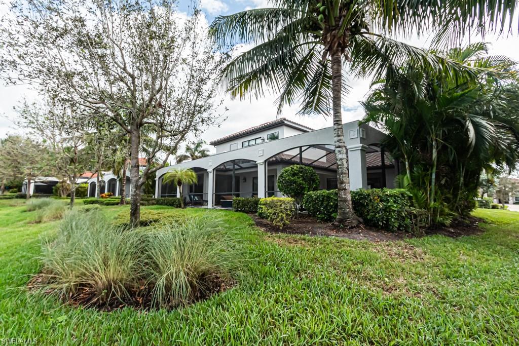 3273 Runaway Lane Naples, FL 34114 - Photo 44 of 45 a front view of a house with a yard