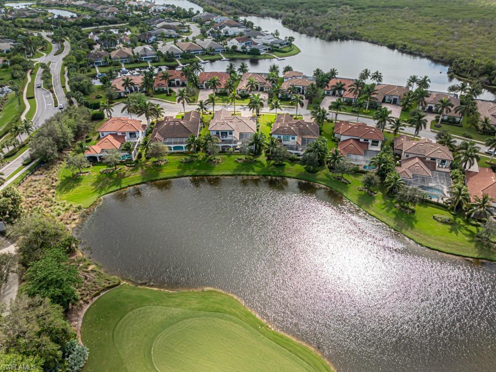 3273 Runaway Lane Naples, FL 34114 - Photo 45 of 45 an aerial view of a house with a garden and lake view