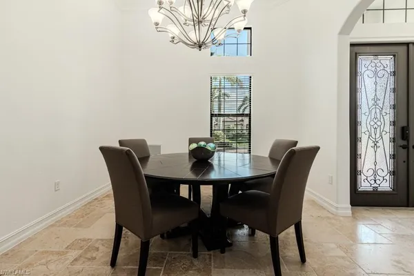 a view of a dining room with furniture and window