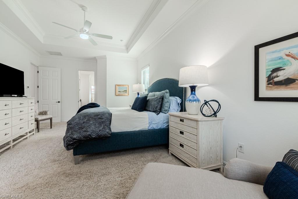 3273 Runaway Lane Naples, FL 34114 - Photo 10 of 45 a spacious bedroom with a bed and a flat screen tv