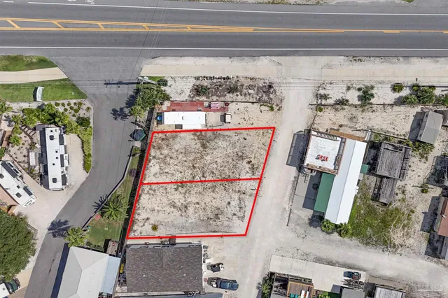 a view of a building with car parked