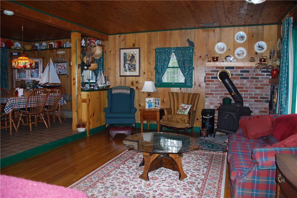 319 Rays Point Road Milbridge, ME 04658 - Photo 9 of 19 Living room with heat stove