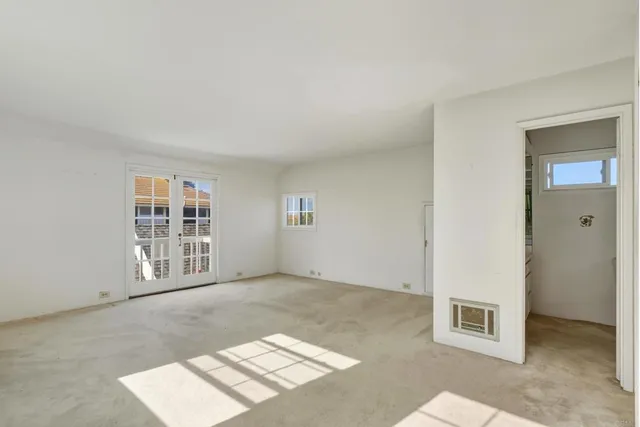 an empty room with windows