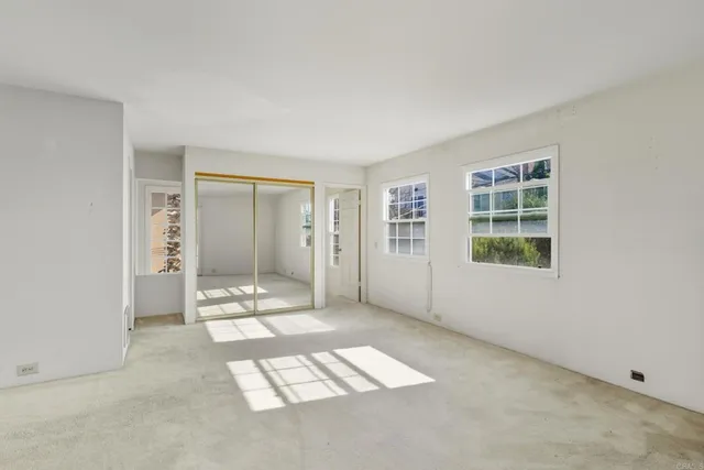 an empty room with windows