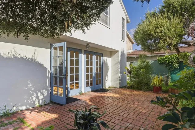 a view of a house with backyard porch and sitting area