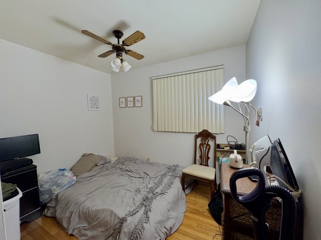 1726 Union Avenue Belvidere, IL 61008 - Photo 14 of 27 a bedroom with a bed and a chandelier