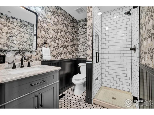 a aerial view of a house with swimming pool and garden