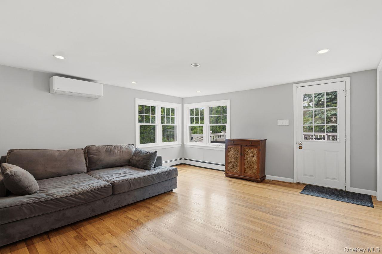 5 Adair Road Cortlandt Manor, NY 10567 - Photo 11 of 36 Living room with door to the deck.