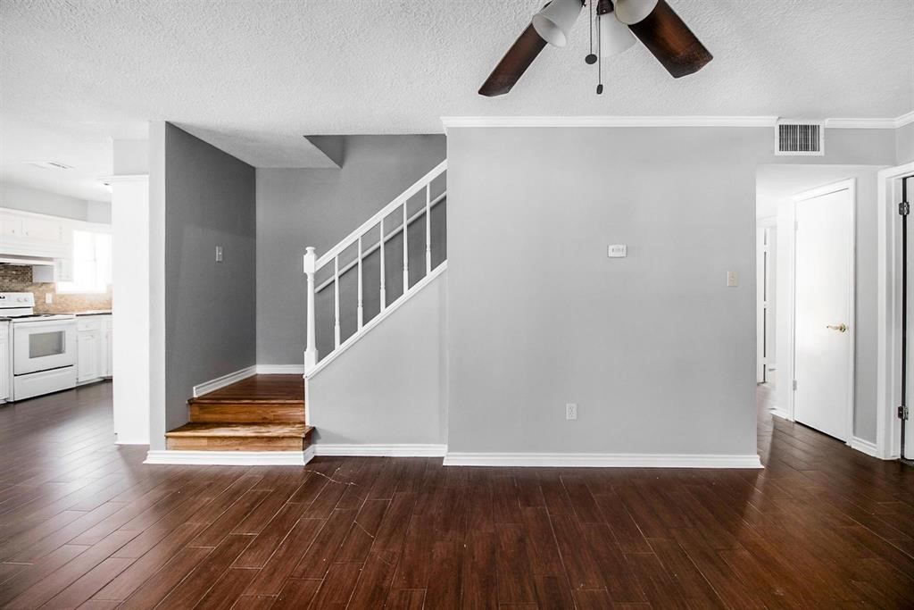 22603 Pine Mist Lane Spring, TX 77373 - Photo 13 of 26 an empty room with wooden floor and entryway