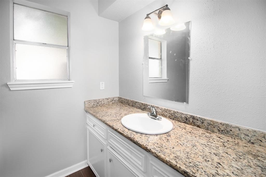 22603 Pine Mist Lane Spring, TX 77373 - Photo 18 of 26 a bathroom with a sink and a mirror