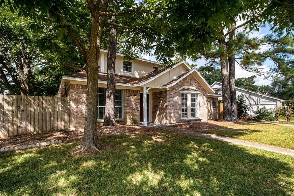 22603 Pine Mist Lane Spring, TX 77373 - Photo 2 of 26 a front view of a house with a yard