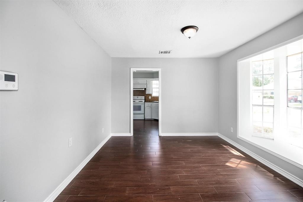 22603 Pine Mist Lane Spring, TX 77373 - Photo 6 of 26 a view of an empty room with wooden floor and a window