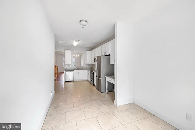 a view of a kitchen with a sink