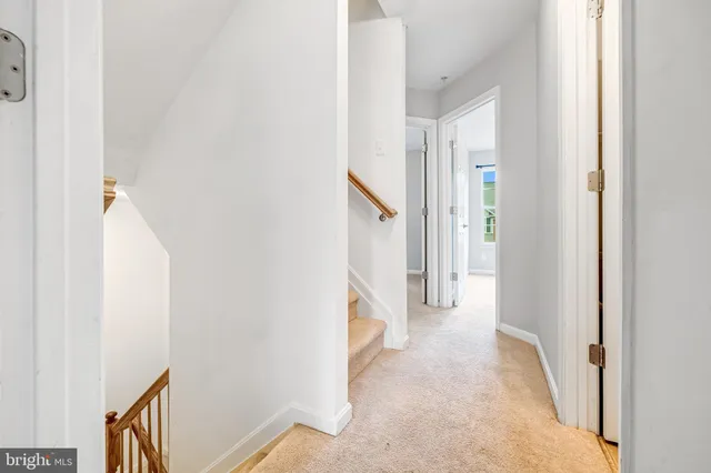 a view of a hallway with staircase