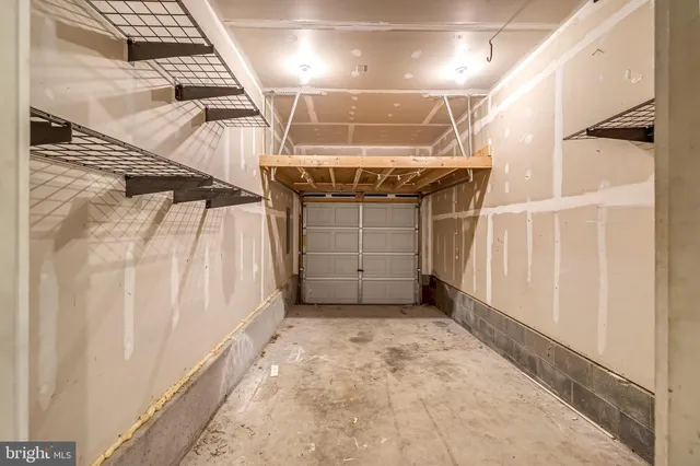 an aerial view of a house with a yard and garden