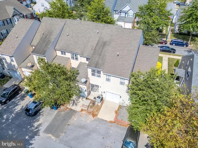 an aerial view of a house with a lake view