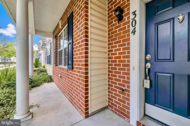 a view of a door and brick walls