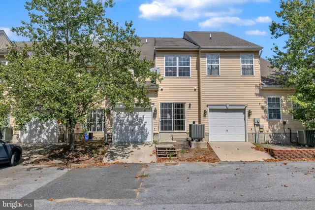 a house view with sitting space and garden