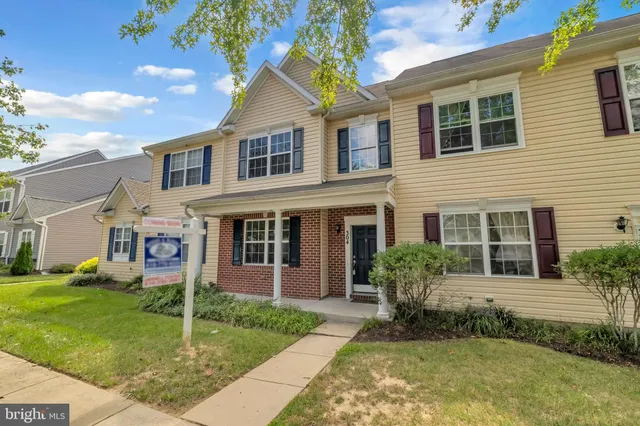 a view of a car parked in front of a house