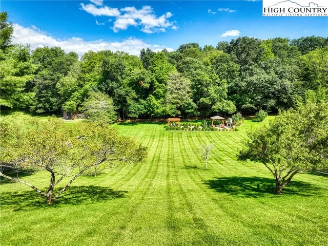 a view of yard with swimming pool