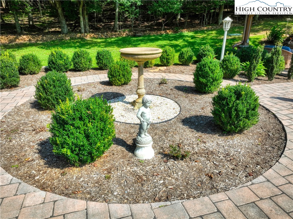 330 Crain Branch Lane Jefferson, NC 28640 - Photo 18 of 45 a view of a backyard with plants and outdoor seating