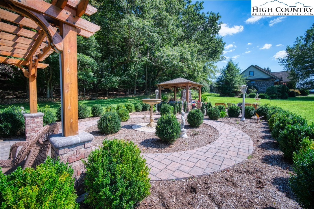 330 Crain Branch Lane Jefferson, NC 28640 - Photo 24 of 45 a view of a table and chairs under an umbrella