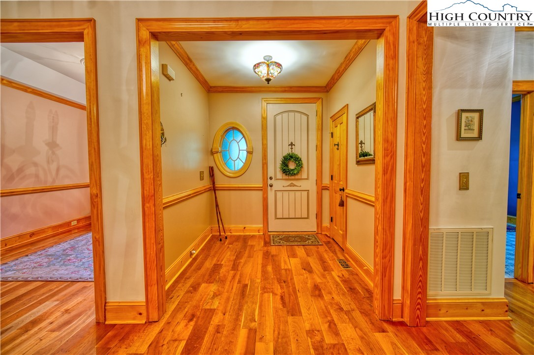 330 Crain Branch Lane Jefferson, NC 28640 - Photo 27 of 45 a view of a hallway with wooden floor