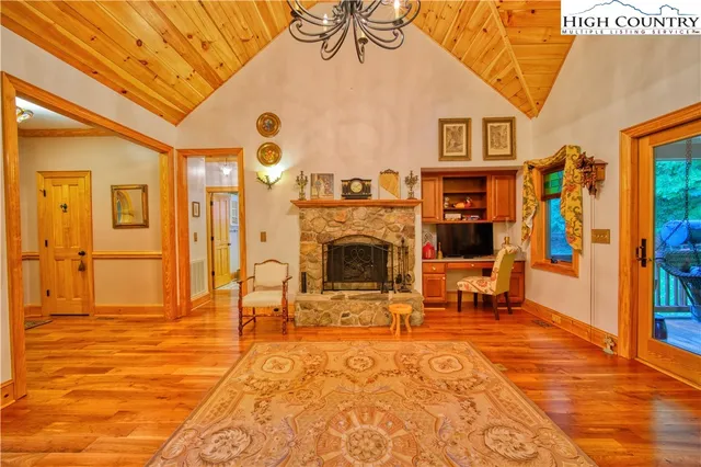 a view of a livingroom with furniture and a fireplace