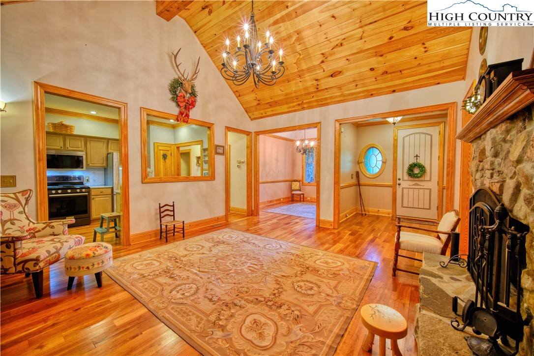 330 Crain Branch Lane Jefferson, NC 28640 - Photo 31 of 45 a bedroom with a bed and dresser with wooden floor