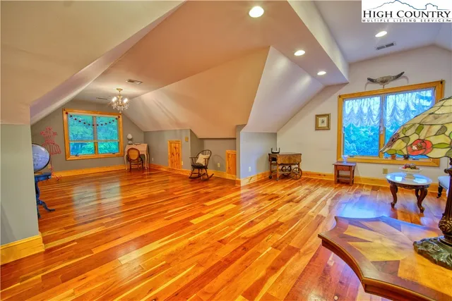 a view of a room with wooden floor