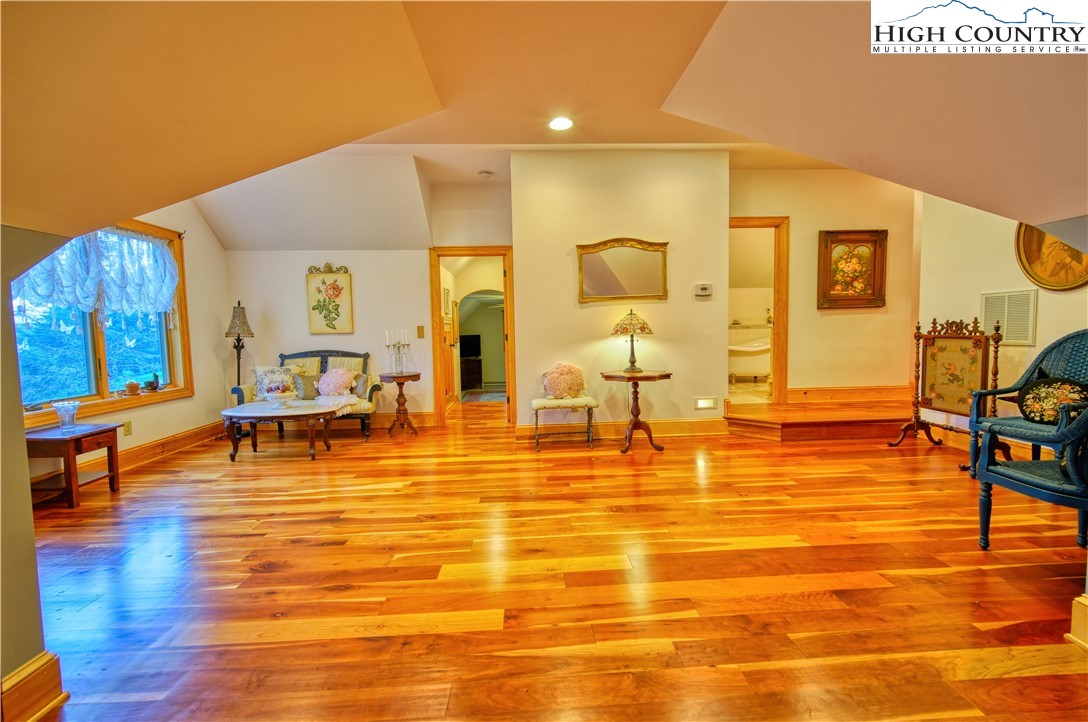 330 Crain Branch Lane Jefferson, NC 28640 - Photo 42 of 45 a living room with chairs and wooden floor