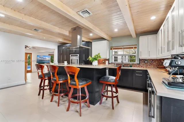 a bedroom with furniture and a flat screen tv