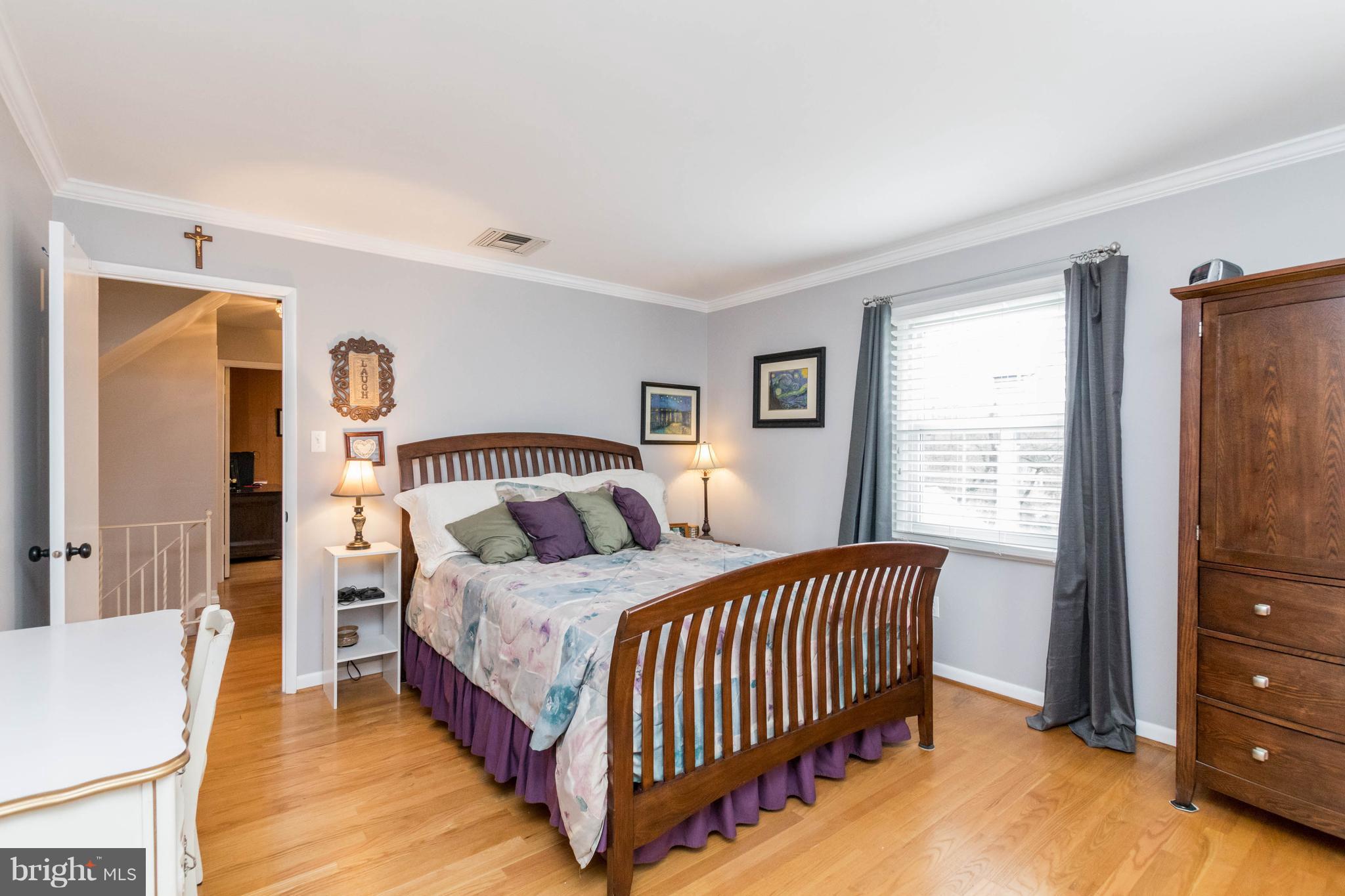 239 Ridgeway Road Catonsville, MD 21228 - Photo 22 of 30 a bedroom with a bed and a dresser