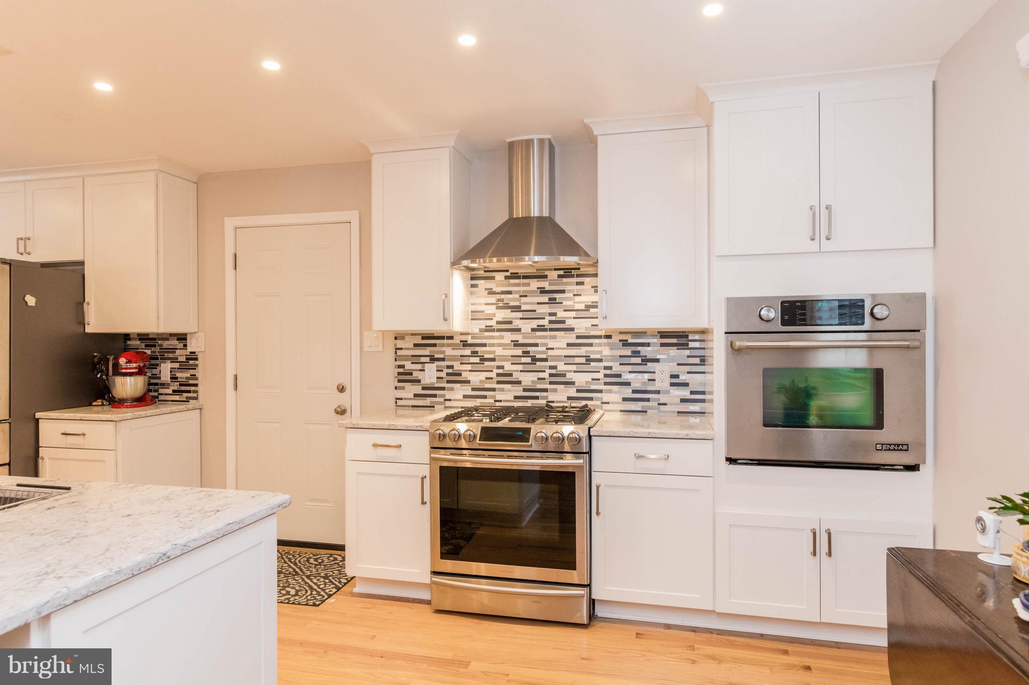 239 Ridgeway Road Catonsville, MD 21228 - Photo 23 of 30 a kitchen with stainless steel appliances granite countertop a stove and a refrigerator