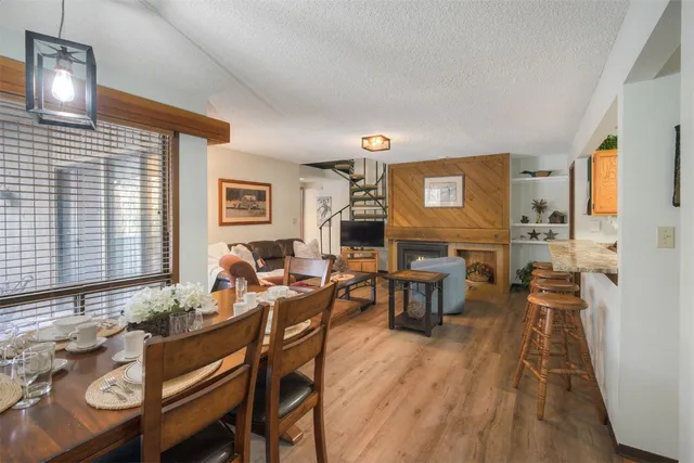 a living room with furniture a window and a flat screen tv