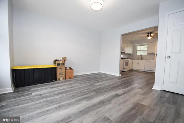 a view of a room with wooden floor