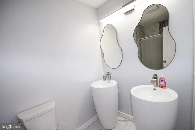 a bathroom with a toilet and a sink